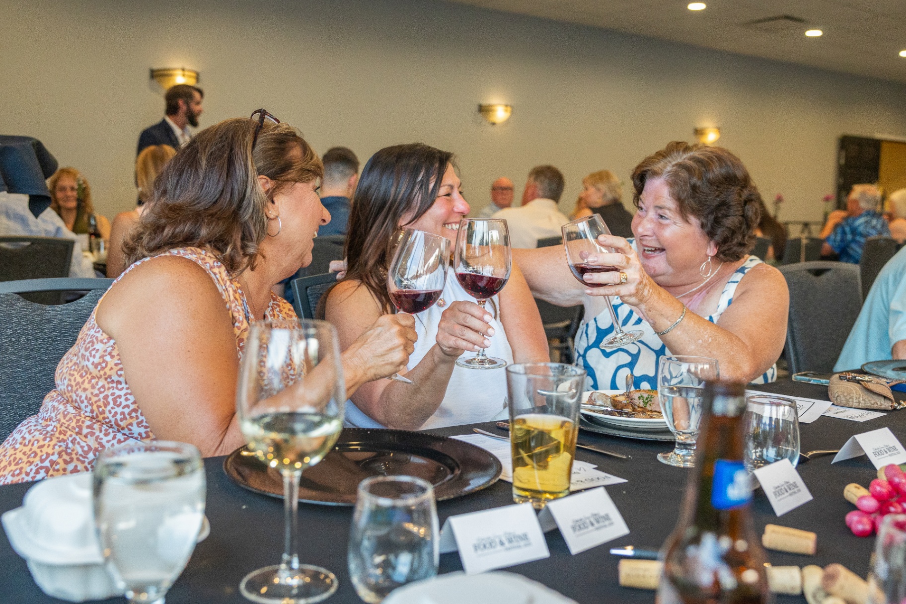 Guests toasting with wine at a private event