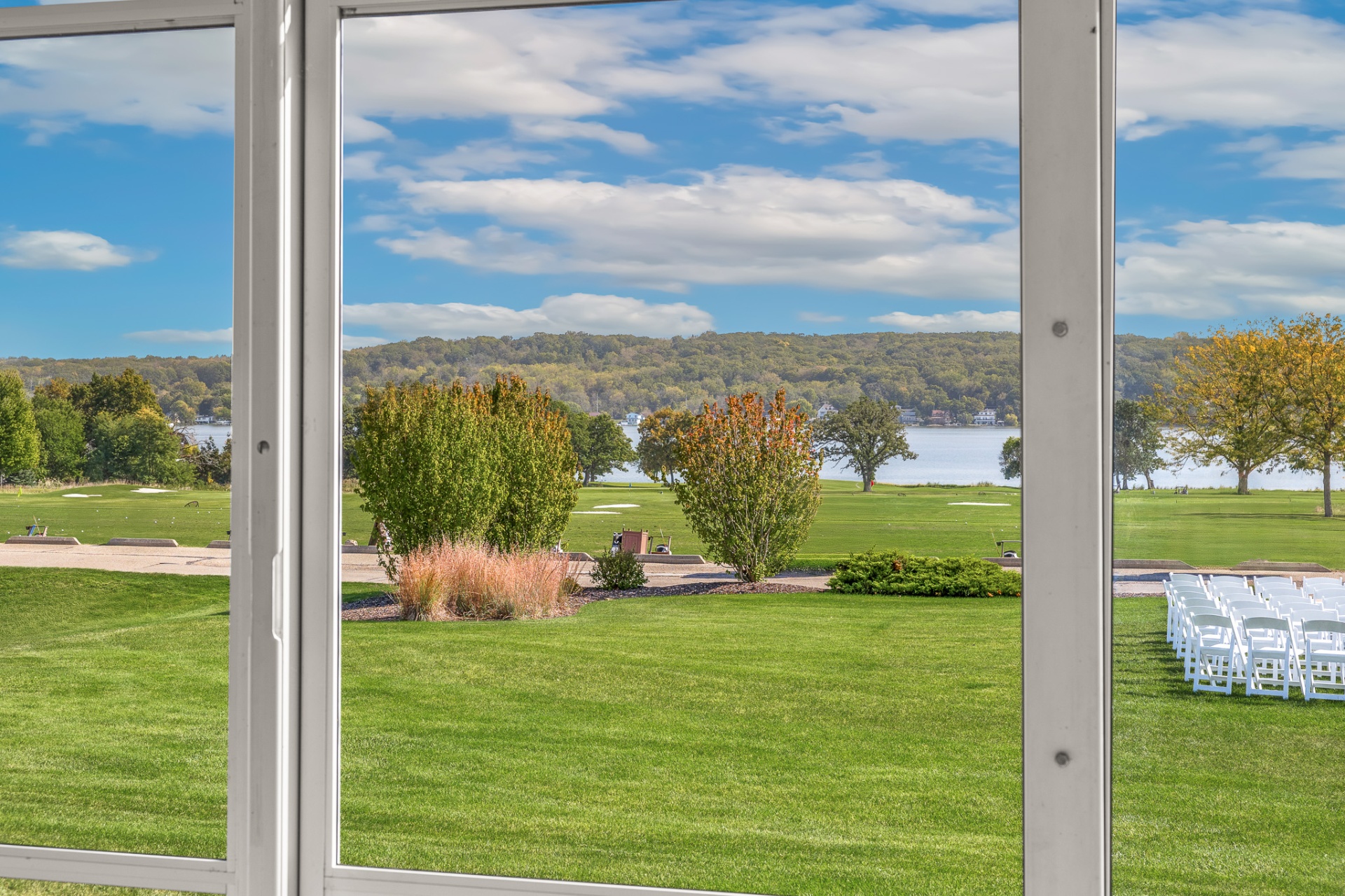 Sweeping lake and lawn views from inside the event tent